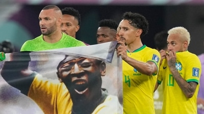 Brazilian players hold a banner in honour of the 82-year-old Brazilian legend Pele (AP) Brazilian players hold a banner in honour of the 82-year-old Brazilian legend Pele (AP)