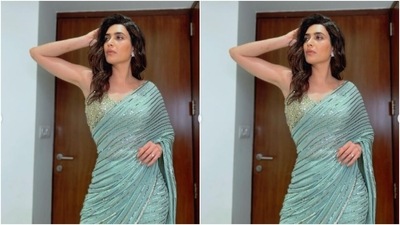 Karishma played muse to fashion designer house Prevasu and picked a shimmery pastel blue saree from the shelves of the designer house. (Instagram/@karishmaktanna) Karishma played muse to fashion designer house Prevasu and picked a shimmery pastel blue saree from the shelves of the designer house. (Instagram/@karishmaktanna)