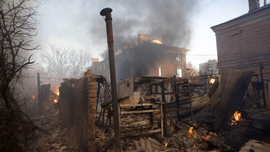 Smoke emanates from multiple buildings after shelling in the Donetsk region on December 4. Known as the epicenter of the Russia - Ukraine war, Donetsk reported damages to multiple residential apartments and administrative buildings.&nbsp;(Yevhen Titov / AFP)