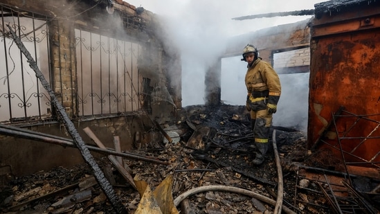 A firefighter works inside an office building heavily damaged in shelling in the course of Russia-Ukraine conflict in Donetsk, on December 5. Ukraine claims that Russia destroyed homes in the southeast and knocked out power lines in multiple regions with an array of missile strikes on Monday, Reuters reported.(Alexander Ermochenko / REUTERS )