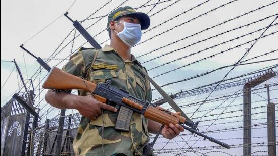 A Border Security Force (BSF) soldier stands guard near the Indo-Pak border. (PTI File Photo)