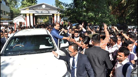 Assam chief minister Himanta Biswa Sarma being greeted by students in Bongaigaon on Monday. (ANI Photo)