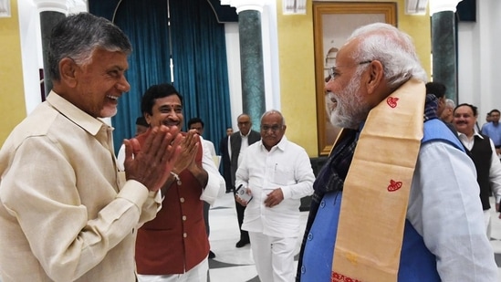 TDP chief and Andhra Pradesh Leader of Opposition N Chandrababu Naidu greets PM Modi.(ANI/PIB)