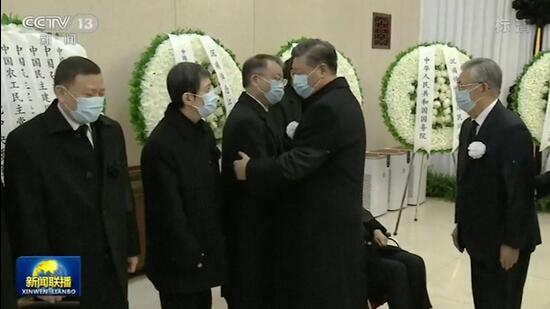 Chinese President Xi Jinping (second from right) and his predecessor Hu Jintao (right) meet with family members of former president Jiang Zemin as they pay respect to Jiang before sent for cremation at Babaoshan cemetery, at a military hospital in Beijing, on Monday. (AP)