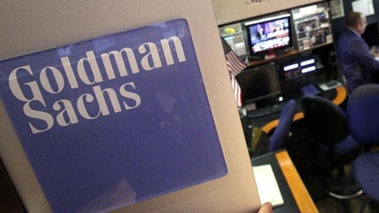 A trader works in the Goldman Sachs booth on the floor of the New York Stock Exchange. Rebecca Allen has sued the company for denying her promotions because of her race.(AP File Photo)