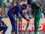India's Virat Kohli, assists in fixing the grip of the bat of Bangladesh's Mehidy Hasan Miraz India's Virat Kohli, assists in fixing the grip of the bat of Bangladesh's Mehidy Hasan Miraz