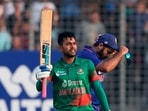 Bangladesh's Mehidy Hasan Miraz, who scored hundred runs raises his bat during the second one day international cricket match between Bangladesh and India in Dhaka, Bangladesh, Wednesday, Dec. 7, 2022. (AP Photo/Surjeet Yadav)(AP) Bangladesh's Mehidy Hasan Miraz, who scored hundred runs raises his bat during the second one day international cricket match between Bangladesh and India in Dhaka, Bangladesh, Wednesday, Dec. 7, 2022. (AP Photo/Surjeet Yadav)(AP)