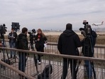 Journalists gather after a commercial airplane flying from Morocco to Turkey made an emergency landing in Barcelona's El Prat airport in the early hours and 28 would-be migrants on board ran away across the tarmac in Barcelona, Spain December 7.