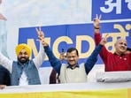 Delhi CM Arvind Kejriwal along with Punjab chief minister Bhagwant Mann and deputy CM Manish Sisodia showing victory sign after MCD win.(Sanchit Khanna/ HT)