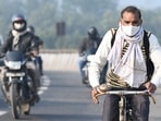 Commuters used mask to avoid air pollution in Noida on Tuesday, Commuters used mask to avoid air pollution in Noida on Tuesday,