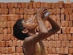 Child labourer works at a brick kiln on a hot summer day in Noida. Children are not able to regulate body temperature like adults and, therefore, are more vulnerable to impact of heat wave.(Burhaan Kinu / Hindustan Times) Child labourer works at a brick kiln on a hot summer day in Noida. Children are not able to regulate body temperature like adults and, therefore, are more vulnerable to impact of heat wave.(Burhaan Kinu / Hindustan Times)