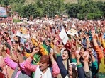BJP supporters attend the 'Hattee Aabhar Rally' addressed by Union Home Minister Amit Shah in Sataun village, Shillai, in Sirmaur. (ANI)(HT_PRINT) BJP supporters attend the 'Hattee Aabhar Rally' addressed by Union Home Minister Amit Shah in Sataun village, Shillai, in Sirmaur. (ANI)(HT_PRINT)