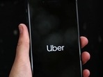 Australia: Uber's logo is displayed on a mobile phone. Australia: Uber's logo is displayed on a mobile phone.