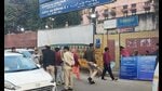 New Delhi: Police personnel guard outside a counting centre for the MCD elections at Paschim Puri, in New Delhi, Wednesday, (PTI) New Delhi: Police personnel guard outside a counting centre for the MCD elections at Paschim Puri, in New Delhi, Wednesday, (PTI)