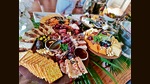Common accoutrements on a cheeseboard include fruits and spreads, crackers or bread, olive oil, honey and pickles. Common accoutrements on a cheeseboard include fruits and spreads, crackers or bread, olive oil, honey and pickles.