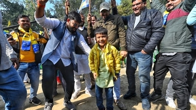 AAP supporters seen dancing with party flags and posters after the party crossed the crucial mark of 126 seats to secure a majority in the MCD. (Sanchit Khanna/ HT) AAP supporters seen dancing with party flags and posters after the party crossed the crucial mark of 126 seats to secure a majority in the MCD. (Sanchit Khanna/ HT)