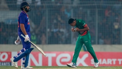Indian captain Rohit Sharma, left, walks back as Bangladesh' Mustafizur Rahman right celebrates winning the second one day international cricket match between Bangladesh and India in Dhaka. (AP) Indian captain Rohit Sharma, left, walks back as Bangladesh' Mustafizur Rahman right celebrates winning the second one day international cricket match between Bangladesh and India in Dhaka. (AP)