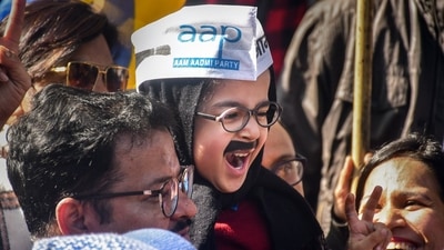 AAP supporters celebrate MCD election results at the party head-office, in New Delhi, on Wednesday. (PTI) AAP supporters celebrate MCD election results at the party head-office, in New Delhi, on Wednesday. (PTI)