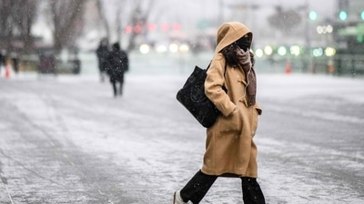 South Korea: A woman walks in Gwanghwamun Plaza as it snows in Seoul. (AFP) South Korea: A woman walks in Gwanghwamun Plaza as it snows in Seoul. (AFP)