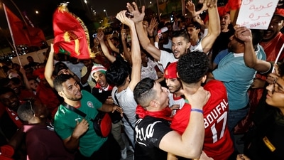 FIFA World Cup 2022: Morocco fans celebrate outside the stadium after the penalty shootout as Morocco progress to the quarter finals. (REUTERS)