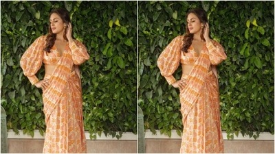Huma teamed her saree with a matching blouse featuring a plunging neckline and puffy full sleeves. In transparent flats with white embellishments, Huma accessorised her look for the day. (Instagram/@iamhumaq) Huma teamed her saree with a matching blouse featuring a plunging neckline and puffy full sleeves. In transparent flats with white embellishments, Huma accessorised her look for the day. (Instagram/@iamhumaq)