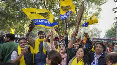 AAP supporters celebrate the party’s Delhi MCD election results outside a counting centre at Patel Nagar, in New Delhi, Wednesday. (PTI) AAP supporters celebrate the party’s Delhi MCD election results outside a counting centre at Patel Nagar, in New Delhi, Wednesday. (PTI)