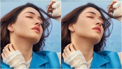 Tamannaah decked up in a white netted top with a closed neckline and full sleeves. She teamed her top with a bright blue sleeveless short dress featuring lapel collars, a blue belt at the waist and pleat and tier details below the waist. (Instagram/@tamannaahspeaks) Tamannaah decked up in a white netted top with a closed neckline and full sleeves. She teamed her top with a bright blue sleeveless short dress featuring lapel collars, a blue belt at the waist and pleat and tier details below the waist. (Instagram/@tamannaahspeaks)