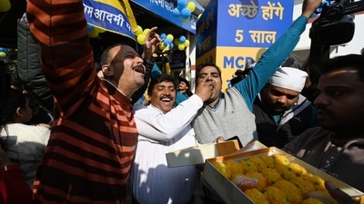 AAP workers seen distributing sweets after a confirmed win. Voting for the MCD polls was held on December 4 and results were declared on December 7. (Sanchit Khanna/ HT) AAP workers seen distributing sweets after a confirmed win. Voting for the MCD polls was held on December 4 and results were declared on December 7. (Sanchit Khanna/ HT)