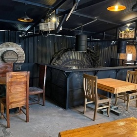 The black painted ceiling and walls give a dark soot-like feel to the hotel. (Kannadiga's Golden Food KGF) The black painted ceiling and walls give a dark soot-like feel to the hotel. (Kannadiga's Golden Food KGF)