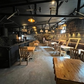 The restaurant has a rustic vibe because of its light wooden tables and chairs. (Kannadiga's Golden Food KGF) The restaurant has a rustic vibe because of its light wooden tables and chairs. (Kannadiga's Golden Food KGF)