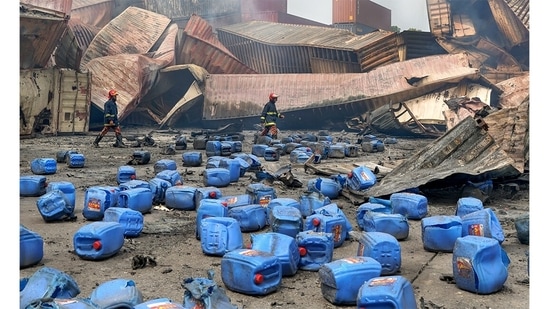 Winner: Keeping 1.5 Alive | Chemical Explosion: This image was made in Sitakunda, Bangladesh on June 8, 2022 – At a chemical explosion and fire at the BM container depot in Sitakunda Upazila, Chittagong where 49 people were killed and the chemicals released from the blaze were mixed in the air and water which had a devastating effect on the environment. The explosion at the depot spilled plastic containers into the nearby river, where the chemical-laced water entered the aquifer and destroyed the fresh water supply. (Subrata Dey / Environmental photographer of the year)