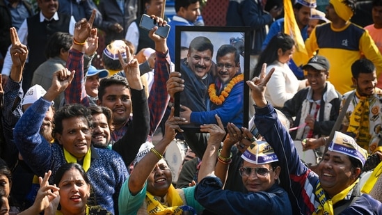 AAP supporters celebrate after winning the MCD Elections 2022 at AAP Headquarters, DDU Marg in New Delhi, India, on Wednesday. (Photo by Sanchit Khanna/ Hindustan Times)