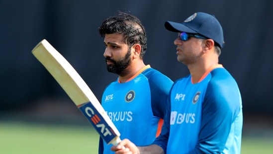 India's captain Rohit Sharma, left and coach Rahul Dravid attend a training session(AP)