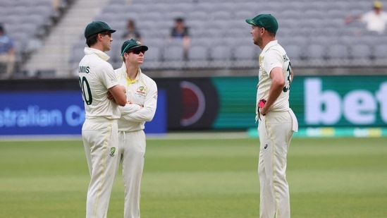 Australia's Pat Cummins (L) and Steve Smith (C) talk with bowler Josh Hazlewood (R) during the fifth day of the first Test cricket match between Australia and the West Indies(AFP) Australia's Pat Cummins (L) and Steve Smith (C) talk with bowler Josh Hazlewood (R) during the fifth day of the first Test cricket match between Australia and the West Indies(AFP)
