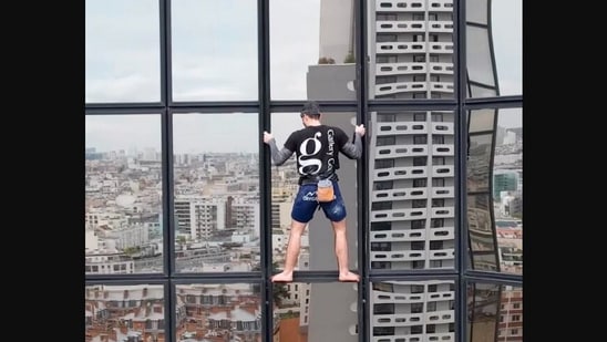 The image, taken from the Instagram video, shows the man climbing a skyscraper.(Instagram/@alexis.landot)