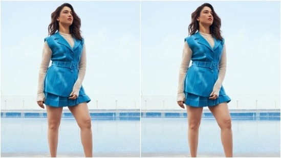 Styled by fashion stylist Shaleena Nathani, Tamannaah wore her tresses open in wavy curls with a side part as she posed for the pictures with the backdrop of a swimming pool.(Instagram/@tamannaahspeaks)