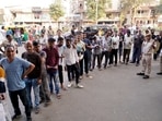 Voters waiting in a queue to cast their vote for the second phase of the Gujarat Assembly Elections, in Ahmedabad. (ANI Photo) Voters waiting in a queue to cast their vote for the second phase of the Gujarat Assembly Elections, in Ahmedabad. (ANI Photo)