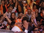 Supporters of the Bharatiya Janata Party (BJP) celebrate as the party recorded a historic win in Gujarat, winning 156 seats in Gujarat Assembly polls. Prime Minister Narendra Modi’s party is all set to keep its 27-year-old control of his home Gujarat state in a record state legislature win.(AP)