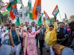 Congress workers celebrate the party's decisive lead in Himachal Pradesh Assembly Election, at the party office in Lucknow, Thursday.