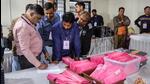 Poll officials at a counting centre in Gujarat on Thursday. (PTI Photo) Poll officials at a counting centre in Gujarat on Thursday. (PTI Photo)