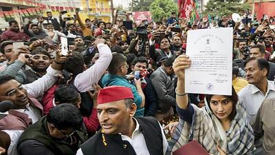 Samajwadi Party ‘s Dimple Yadav shows her election certificate with her husband and party chief Akhilesh Yadav after winning the Mainpuri Lok Sabha bypoll on Thursday. (PTI PHOTO) Samajwadi Party ‘s Dimple Yadav shows her election certificate with her husband and party chief Akhilesh Yadav after winning the Mainpuri Lok Sabha bypoll on Thursday. (PTI PHOTO)