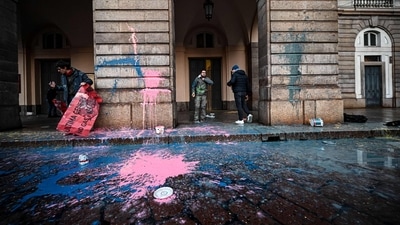 Environmental activists from the "Last Generation" (Ultima Generazione) group smear with paint the facade of the prestigious La Scala theatre ahead of the opening performance of the season, in Milan, Italy, on December 7. "We decided to stain La Scala with paint to ask the politicians who will attend the performance tonight to pull their heads out of the sand and intervene to save the population," wrote Last Generation in a statement, as reported by AFP. (Piero Cruciatti / AFP) Environmental activists from the "Last Generation" (Ultima Generazione) group smear with paint the facade of the prestigious La Scala theatre ahead of the opening performance of the season, in Milan, Italy, on December 7. "We decided to stain La Scala with paint to ask the politicians who will attend the performance tonight to pull their heads out of the sand and intervene to save the population," wrote Last Generation in a statement, as reported by AFP. (Piero Cruciatti / AFP)