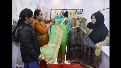 Visitors take a look at dresses at a Pakistani stall on the first day of the Punjab International Trade Expo PHD (PITEX)-2023 at Ranjeet Avenue, Amritsar on Wednesday. (Photo by Sameer Sehgal /Hindustan Times) Visitors take a look at dresses at a Pakistani stall on the first day of the Punjab International Trade Expo PHD (PITEX)-2023 at Ranjeet Avenue, Amritsar on Wednesday. (Photo by Sameer Sehgal /Hindustan Times)