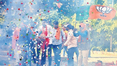 BJP supporters burn firecrackers to celebrate the party’s win in Gandhinagar on Thursday. (Reuters) BJP supporters burn firecrackers to celebrate the party’s win in Gandhinagar on Thursday. (Reuters)
