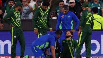Pakistan's Shaheen Afridi, second right, is attended to after falling while catching out England's Harry Brook during the final of the T20 World Cup Cricket tournament at the Melbourne Cricket Ground in Melbourne, Australia, Sunday, Nov. 13, 2022. AP/PTI(AP11_13_2022_000134B) (AP) Pakistan's Shaheen Afridi, second right, is attended to after falling while catching out England's Harry Brook during the final of the T20 World Cup Cricket tournament at the Melbourne Cricket Ground in Melbourne, Australia, Sunday, Nov. 13, 2022. AP/PTI(AP11_13_2022_000134B) (AP)
