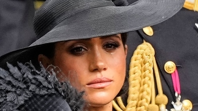 Meghan Markle: Meghan, Duchess of Sussex watches as the coffin of Queen Elizabeth II is placed into the hearse. (AP) Meghan Markle: Meghan, Duchess of Sussex watches as the coffin of Queen Elizabeth II is placed into the hearse. (AP)