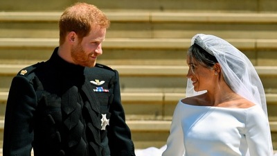 Prince Harry and Meghan Markle walk down the steps after their wedding. (AP) Prince Harry and Meghan Markle walk down the steps after their wedding. (AP)