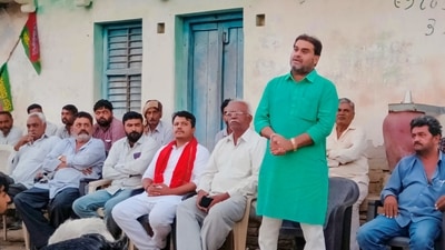 Kutiyana: MLA Kandhal Jadeja addresses a public meeting ahead of Gujarat Assembly elections at a village in Kutiyana constituency in Gujarat. (PTI)