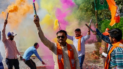BJP workers burn firecrackers celebrating the party's decisive lead in Gujarat Assembly elections in Gandhinagar. (PTI) BJP workers burn firecrackers celebrating the party's decisive lead in Gujarat Assembly elections in Gandhinagar. (PTI)