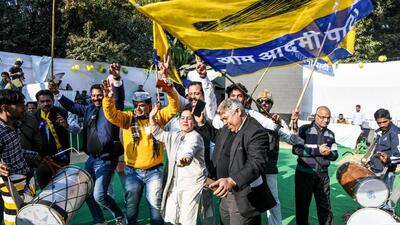 Aam Aadmi Party supporters celebrate at the party headquarters in New Delhi. (ANI) Aam Aadmi Party supporters celebrate at the party headquarters in New Delhi. (ANI)